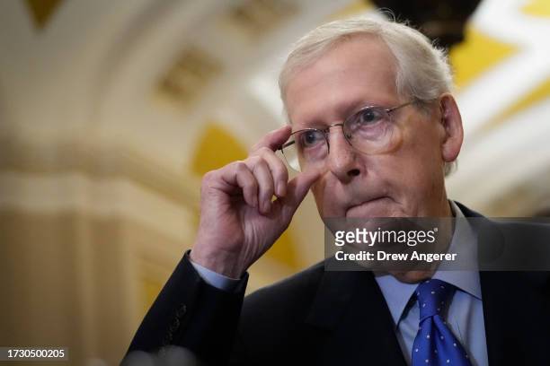 Senate Minority Leader Mitch McConnell arrives to speak to reporters following a closed-door lunch meeting with Senate Republicans at the U.S....