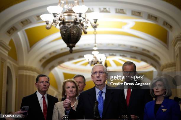Senate Minority Leader Mitch McConnell speaks to reporters following a closed-door lunch meeting with Senate Republicans at the U.S. Capitol October...