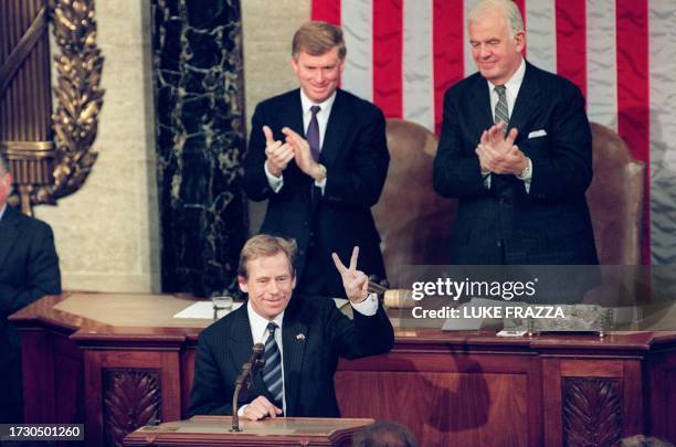 President Vaclav Havel of Czechoslovakia flashes a victory sign 21 February 1990 during a speech before a joint session of the US Congress. Havel...