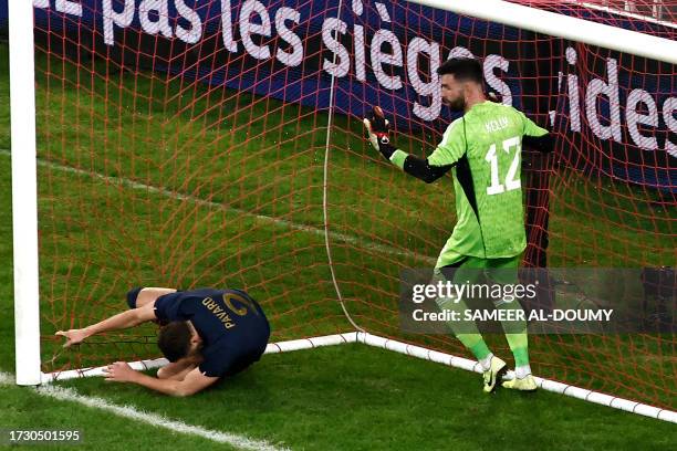 France's defender Benjamin Pavard falls and obtains a penalty during the friendly football match between France and Scotland at Pierre-Mauroy...