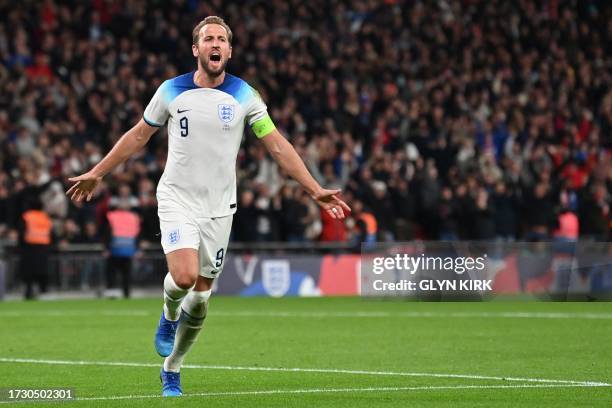 England's striker Harry Kane celebrates after scoring his team thrid goal during the Euro 2024 qualifying group C football match between England and...