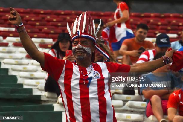 Fan of Paraguay cheers for his team before the 2026 FIFA World Cup South American qualification football match between Paraguay and Bolivia at the...