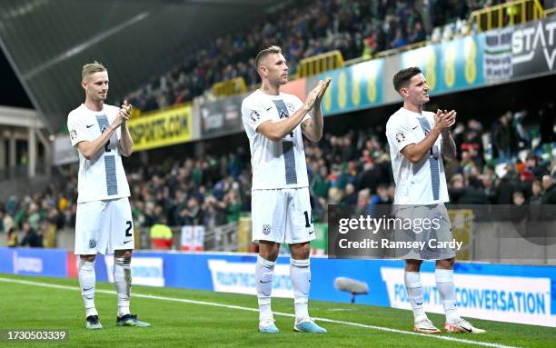 Belfast , United Kingdom - 17 October 2023; an Karninik, left, Jasmin Kurtic, centre, and Benjamin Verbi of Slovenia after the UEFA EURO 2024...