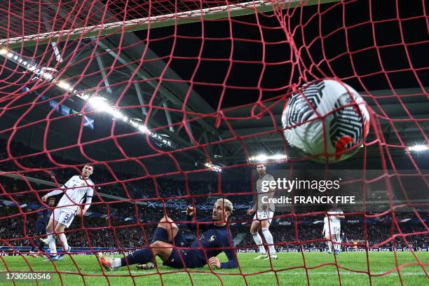 France's forward Antoine Griezmann reacts as France's forward Kingsley Coman scores his team's fourth goal during the friendly football match between...