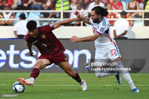 Venezuela's defender Yordan Osorio and Chile's forward Ben Brereton fight for the ball during the 2026 FIFA World Cup South American qualification...