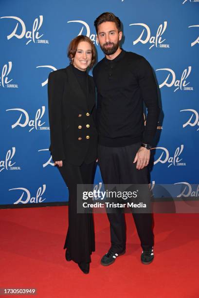 Sebastian Fobe and Liza Waschke attend the "Dali: Surreal" Exhibition VIP Opening at Neukölln Speicher on October 17, 2023 in Berlin, Germany.