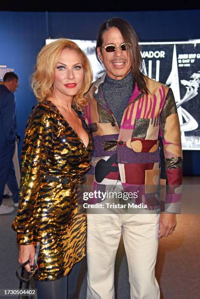 Sonya Kraus and Jorge Gonzalez attend the "Dali: Surreal" Exhibition VIP Opening at Neukölln Speicher on October 17, 2023 in Berlin, Germany.