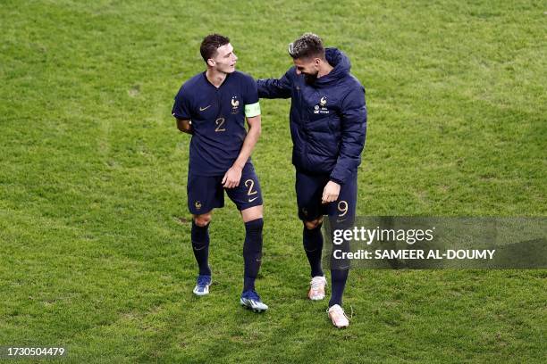 France's defender Benjamin Pavard and France's forward Olivier Giroud celebrate after winning the friendly football match between France and Scotland...