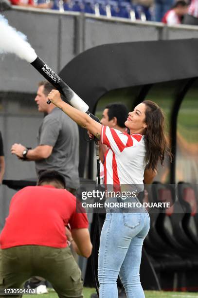 Paraguay's model Larissa Riquelme uses a smoke machine before the beginning of the 2026 FIFA World Cup South American qualification football match...