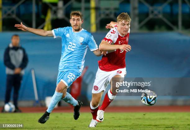 Rasmus Hojlund of Denmark competes for the ball with Marcello Mularoni of San Marino during the UEFA EURO 2024 European qualifier match between San...