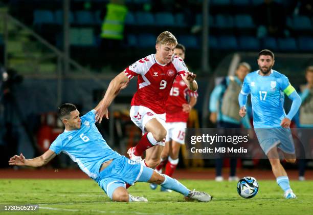 Rasmus Hojlund of Denmark competes for the ball with Dante Rossi of San Marino during the UEFA EURO 2024 European qualifier match between San Marino...