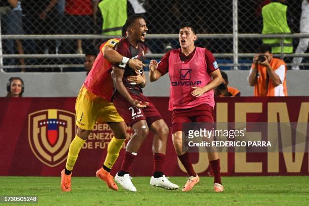 Venezuela's forward Salomon Rondon celebrates with teammates after scoring during the 2026 FIFA World Cup South American qualification football match...