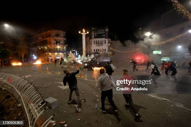 People gather to protest after a blast at Al-Ahli Baptist Hospital in Gaza as Israeli attacks continue, in Ramallah, West Bank on October 17, 2023....