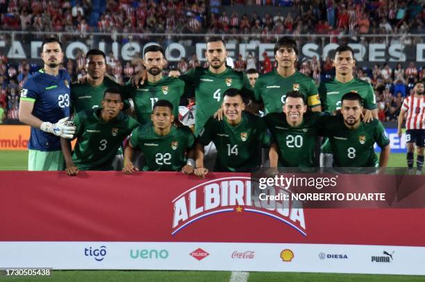 Bolivia players pose for a picture before the 2026 FIFA World Cup South American qualification football match between Paraguay and Bolivia at the...