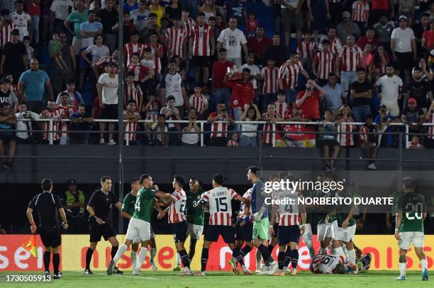 Players from both teams scuffle during the 2026 FIFA World Cup South American qualification football match between Paraguay and Bolivia at the...