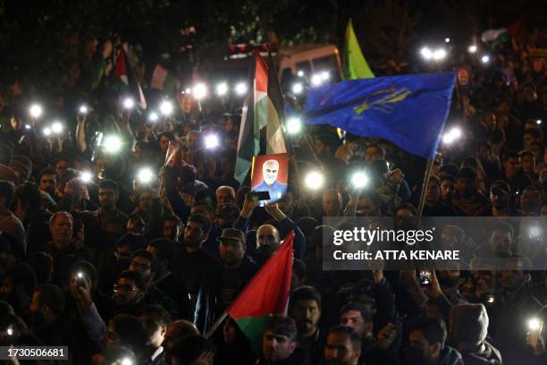 Picture of slain Iranian Revolutionary Guards commander Qasem Soleimani is pictured as students and demonstrators protest in support of Palestinians...