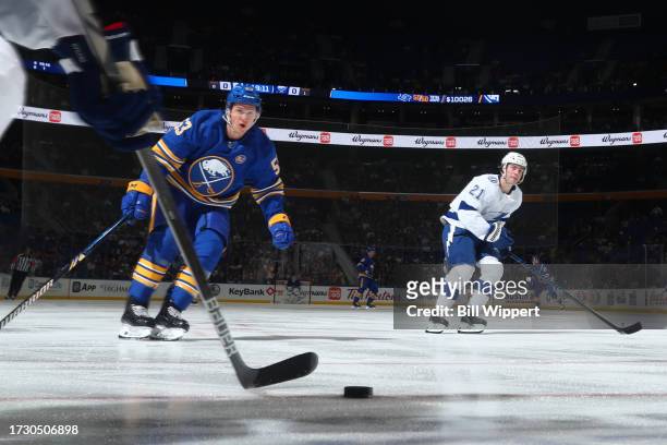 Jeff Skinner of the Buffalo Sabres and Brayden Point of the Tampa Bay Lightning anticipate a pass during an NHL game on October 17, 2023 at KeyBank...