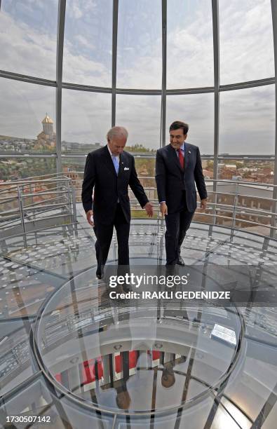 Georgian President Mikheil Saakashvili and US Vice President Joe Biden walk inside the glass cupola atop the presidential residence in Tbilisi on...