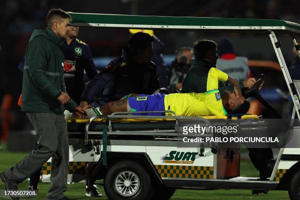 Brazil's forward Neymar leaves the field after an injury during the 2026 FIFA World Cup South American qualification football match between Uruguay...