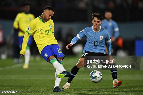 Brazil's forward Neymar and Uruguay's midfielder Facundo Pellistri fight for the ball during the 2026 FIFA World Cup South American qualification...
