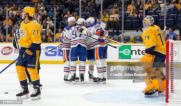 Edmonton Oilers center Leon Draisaitl celebrates his goal with teammates against the Nashville Predators during an NHL game at Bridgestone Arena on...