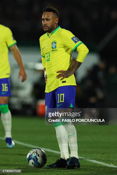 Brazil's forward Neymar stands in front of the ball during the 2026 FIFA World Cup South American qualification football match between Uruguay and...