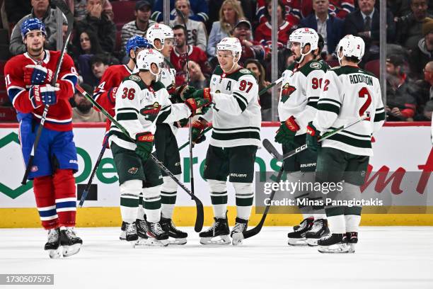 Kirill Kaprizov of the Minnesota Wild celebrates his goal with teammates Mats Zuccarello, Marcus Johansson and Calen Addison during the second period...