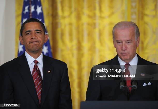 President Barack Obama watches as Vice President Joe Biden speaks on the Middle Class Working Families Taskforce January 30, 2009 in the East Room of...