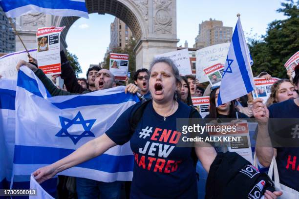 Pro-Israel counter protestors chant across a line of police officers towards a vigil organized by NYU students in support of Palestinians in...