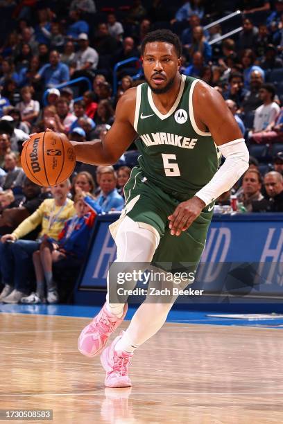 Malik Beasley of the Milwaukee Bucks dribbles the ball during the game against the Oklahoma City Thunder on October 17, 2023 at Paycom Center in...