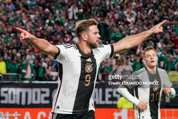 Germany's forward Niclas Fullkrug celebrates scoring his team's second goal during the international friendly football match between Germany and...