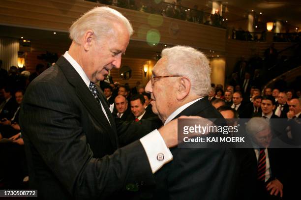 Vice-President Joe Biden talks with former US Foreign Minister Henry Kissinger on the second day of the 45th Munich Security Conference at the...
