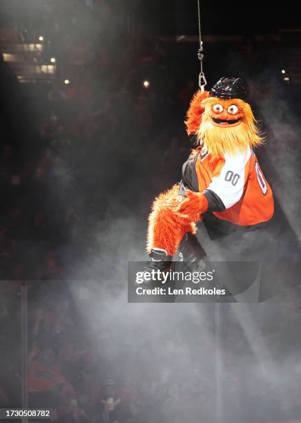 Gritty the mascot of the Philadelphia Flyers zipline downs to the ice prior to an NHL game against the Vancouver Canucks at the Wells Fargo Center on...