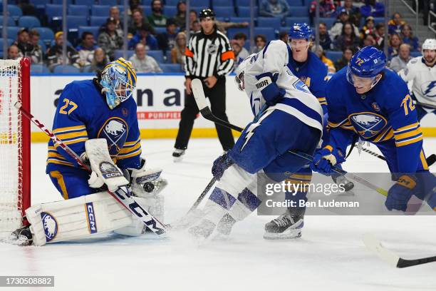 Devon Levi of the Buffalo Sabres makes a save against the Tampa Bay Lightning during an NHL game on October 17, 2023 at KeyBank Center in Buffalo,...