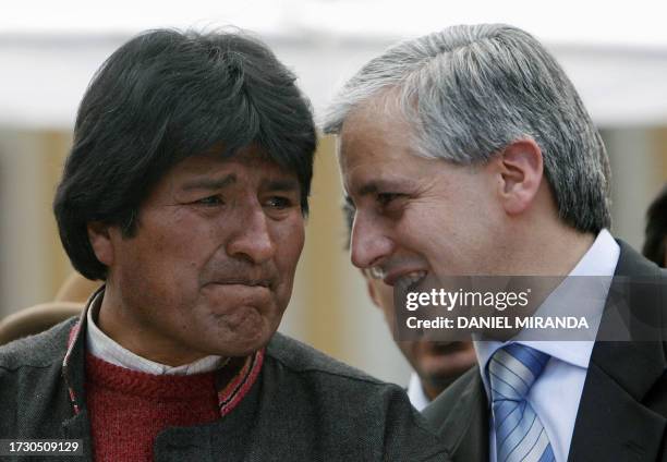 The President of Bolivia Evo Morales Ayma cries as he listens to Vice President Alvaro Garcia Linera after the congress passed the law to call a...