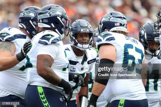 Seattle Seahawks quarterback Geno Smith talks to his players in the huddle during the game against the Seattle Seahawks and the Cincinnati Bengals on...