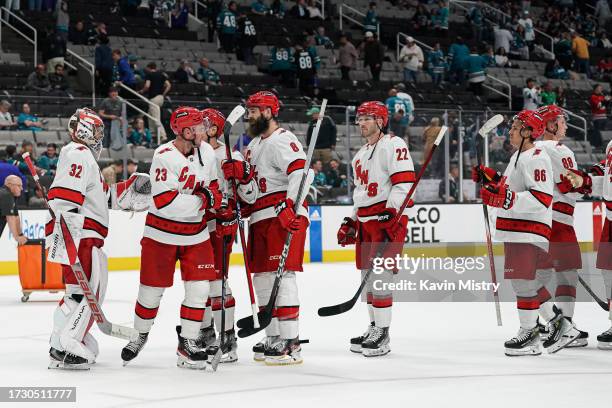 The Carolina Hurricanes celebrate the win against the San Jose Sharks at SAP Center on October 17, 2023 in San Jose, California.