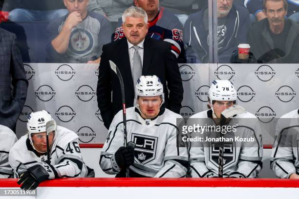 Head Coach Todd McLellan of the Los Angeles Kings looks on from the bench during third period action against the Winnipeg Jets at the Canada Life...