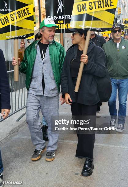 Ethan Hawke and Rosario Dawson are seen on the SAG-AFTRA picket line outside the HBO Max building on October 17, 2023 in New York City.