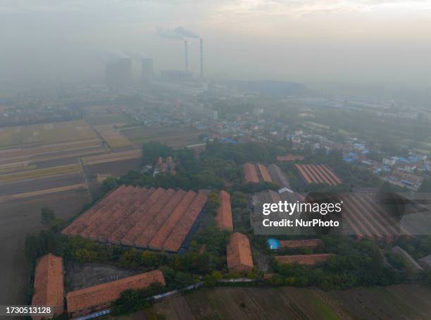 Aerial photo taken on October 18, 2023 shows the old factory buildings of Huaiyin Second Cotton Textile Factory, which has been abandoned for...