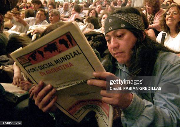 During the closing ceremony of the forum, an indian of Guarani descendacy reads a newspaper about the Global Social Forum in a class room of the the...