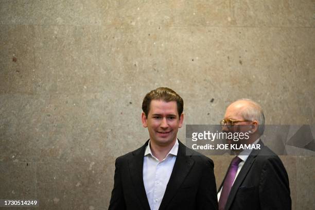 Austria's former chancellor Sebastian Kurz and an unidentified lagal aide arrive in court in Vienna, Austria, on October 18, 2023. Kurz goes on trial...
