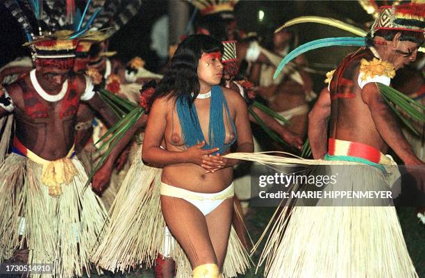 Ethnic Indians of the Xavante and Mehinaku tribes demonstrate a right of passage during the innaguration of the exposition, "Brazil: 500 " in Sao...