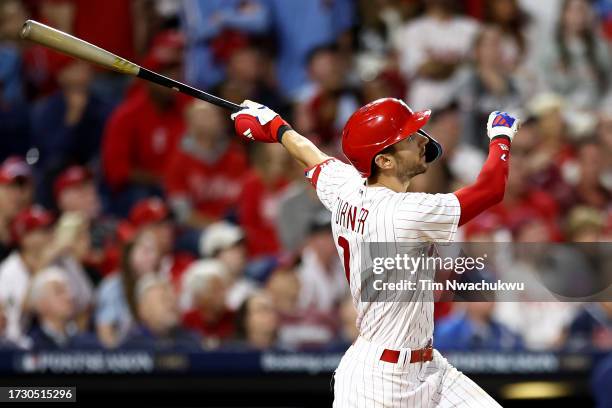 Trea Turner of the Philadelphia Phillies hits a solo home run against the Atlanta Braves during the sixth inning in Game Three of the Division Series...