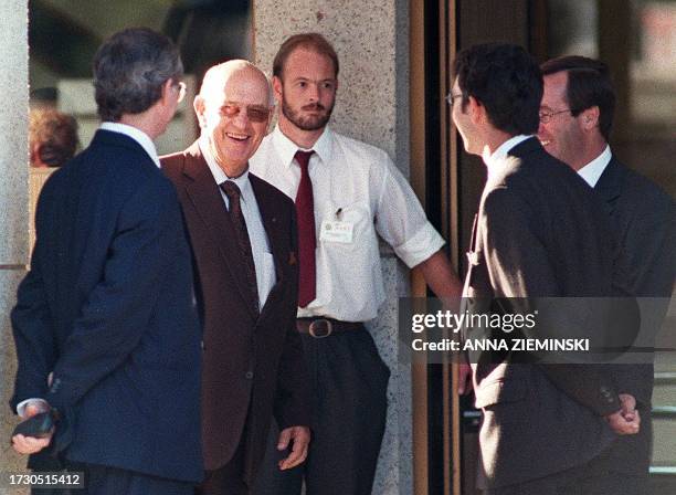 Former apartheid-era State President P W Botha smiles as he chats to lawyers and Truth and Reconciliation Commission witness Paul van Zyl as he...