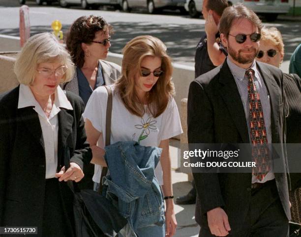 Jennifer McVeigh , sister of Timothy McVeigh, and defense lawyer Randal Coyne leave the Byron G. Rogers Federal Building and United States Court...