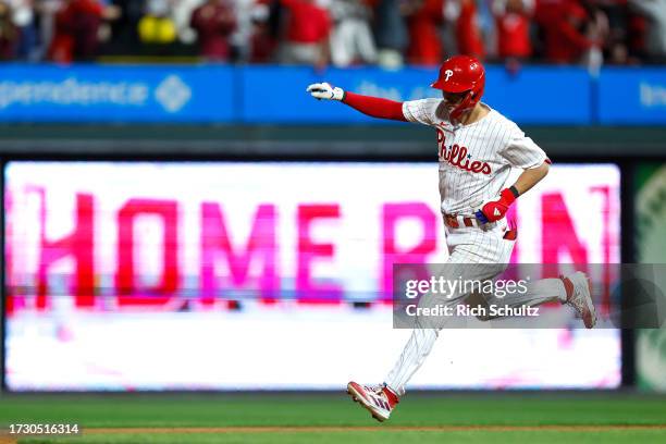 Trea Turner of the Philadelphia Phillies rounds the bases after hitting a solo home run against the Atlanta Braves during the sixth inning in Game...