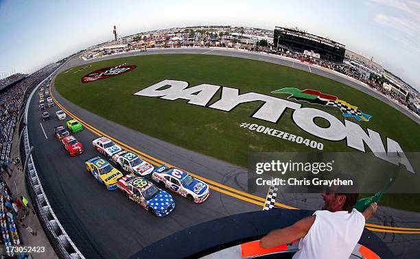 Austin Dillon, driver of the AdvoCare Chevrolet, and Travis Pastrana, driver of the Roush Fenway Racing / RaceTrac Ford, lead the field to start the...