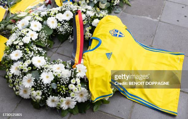 Flowers and a shirt of the Swedish national soccer team pictured at a commemoration for the victims of monday's terrorist attack against Swedish...