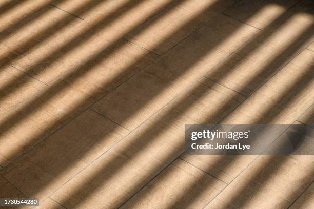 sun streams across floor - jordan ray stock pictures, royalty-free photos & images